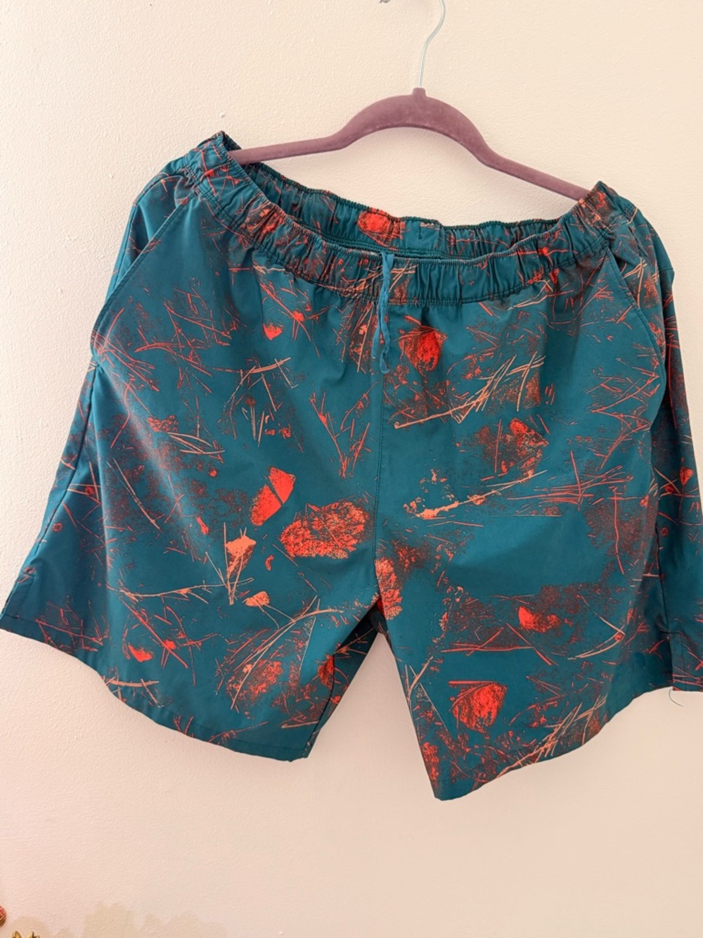 The North Face Teal Shorts with Orange Abstract Print